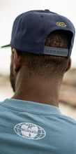 Load image into Gallery viewer, &quot;CRIME RULES EVERYTHING AROUND ME&quot; NAVY SNAPBACK